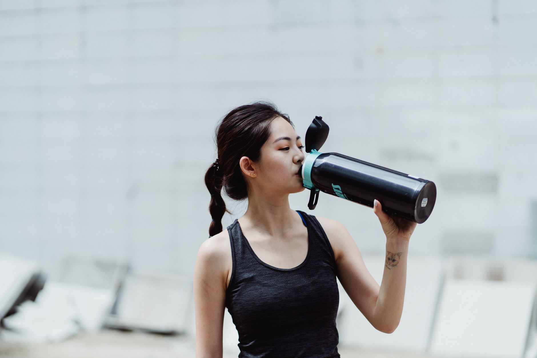 portrait of a woman drinking water