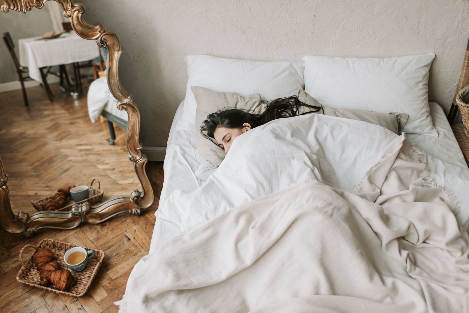 a woman sleeping on bed