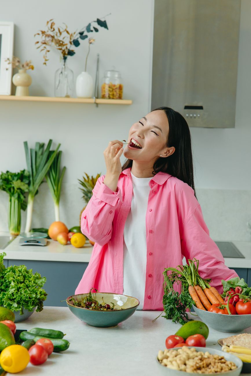 a woman eating vegetables